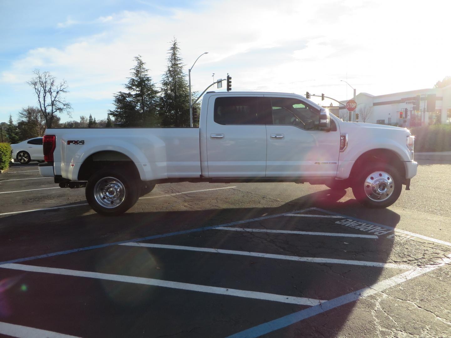 2020 White /BLACK Ford F-450 SD PlatinumCrew Cab DRW 4WD (1FT8W4DT4LE) with an 6.7L V8 OHV 16V DIESEL engine, 6A transmission, located at 2630 Grass Valley Highway, Auburn, CA, 95603, (530) 508-5100, 38.937893, -121.095482 - Must see F450 with a tool box refueling station, window tint, and a center console vault. - Photo#3